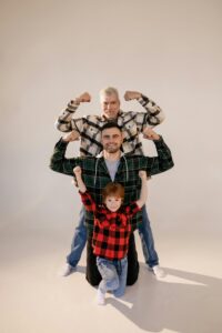 Three generations standing together, symbolizing strength, unity, and emotional legacy in families.